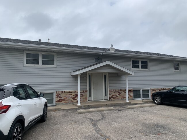 Front of the 4-plex with off street parking - 513 W 36th St