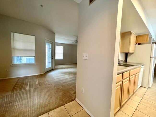 Building Photo - Move in NOW- Spacious 2 bedroom 1 bath condo on 3rd floor in gated community! Water included with...