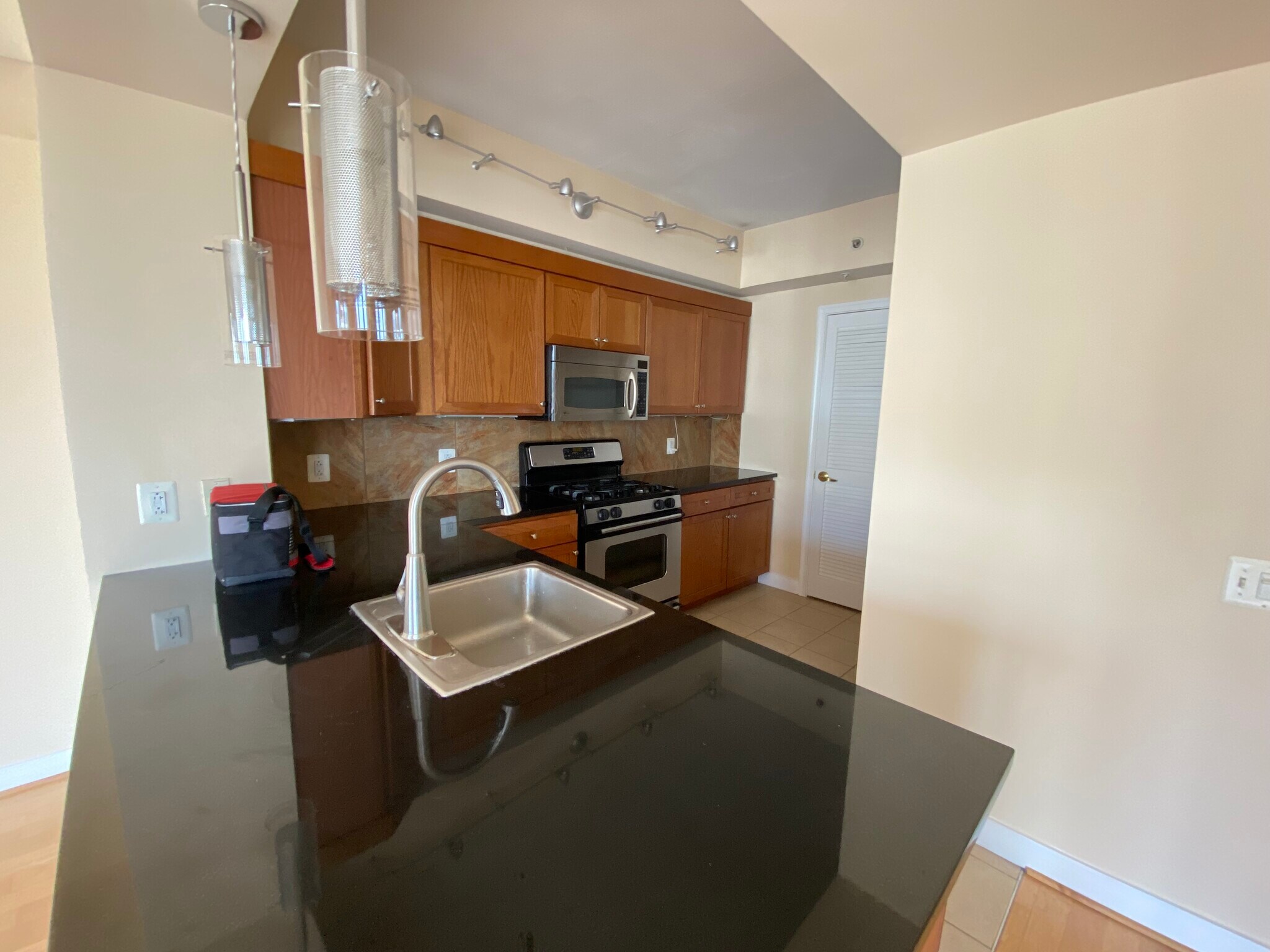 Kitchen with stainless steel appliances, pantry, laundry room - 616 E St NW