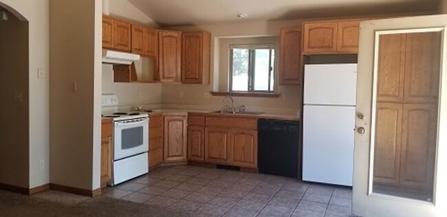 Building Photo - Spacious 4 Bed, 2 Bath Home with Finished Basement, Large Deck & Yard Near CSU