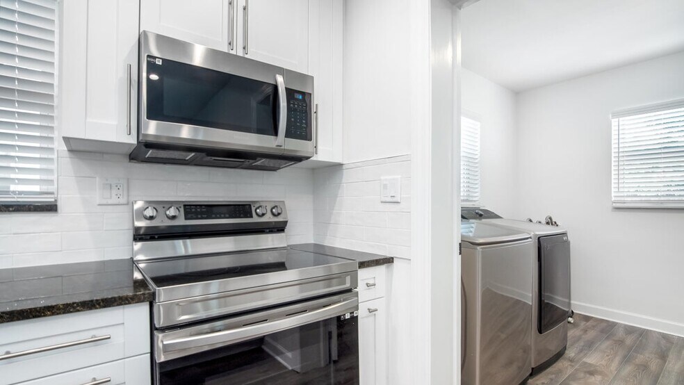 Kitchen facing west. - 121 George Bush Blvd