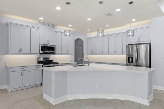 Building Photo - Spacious 6-Bedroom Home Near Lake Nona | 3-Car Garage + Tesla Charger
