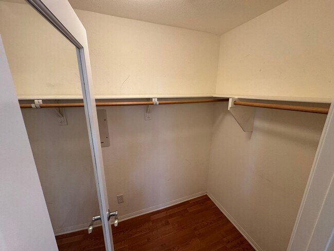 Building Photo - Sleek 2-Bed with a Den/Office + Flex Corner Condo with Attached Tandem Garage