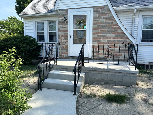 New porch built last year (grass has grown back) - 128 Standish Dr