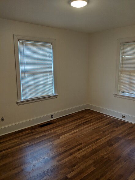 Bedroom 1 - Fresh paint, new lighting, refinished floors! - 1111 Watauga St