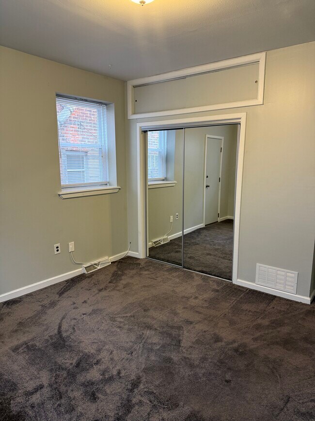 Bedroom closet with mirrored doors - 1217 Snyder Ave