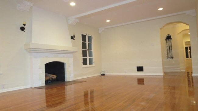 Living Room with Period Details at Night - 1103 S Crescent Heights Blvd