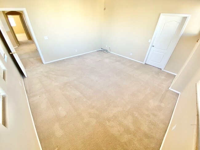 Building Photo - THIS SPACIOUS RESIDENCE FEATURES 4 BEDROOM...