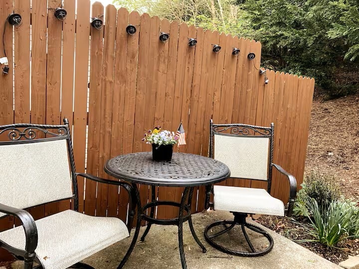 Patio table and chairs off the kitchen with outdoor mood lighting. - 515 School Ln