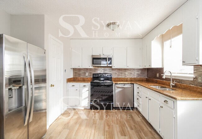 Building Photo - The living is easy in this 3 bedroom, 2.5 bathroom home