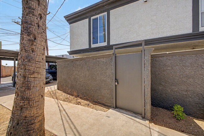 Building Photo - Spacious 2 Bed + Bonus Room | Large Private Yards | Covered Parking | 8 Weeks Free Rent!