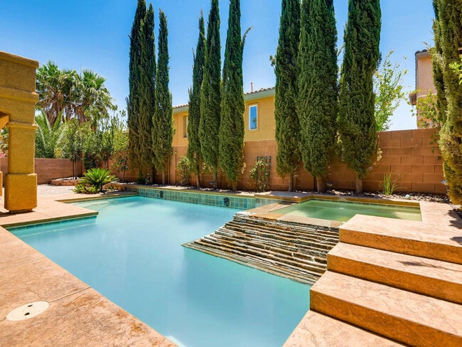 Building Photo - LUXURIOUS UPGRADED HOME IN A GATED SUMMERLIN AREA!!HOUSE HAS POOL AND SPA AND PATIO COVERED BACKY...