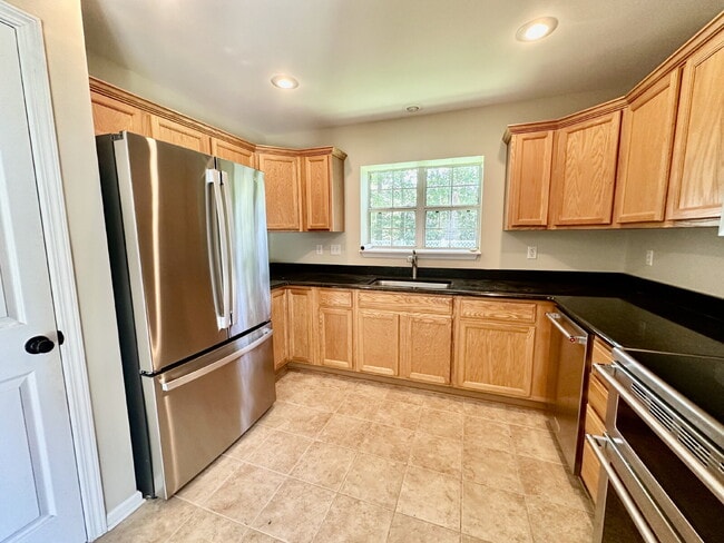 Building Photo - Four Bedroom Home with Private Fenced Back...