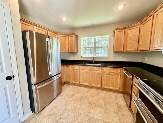 Building Photo - Four Bedroom Home with Private Fenced Back Yard in the Farm!