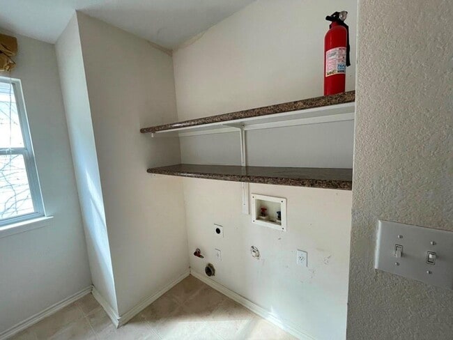 Building Photo - Spacious open floor plan with this desirab...