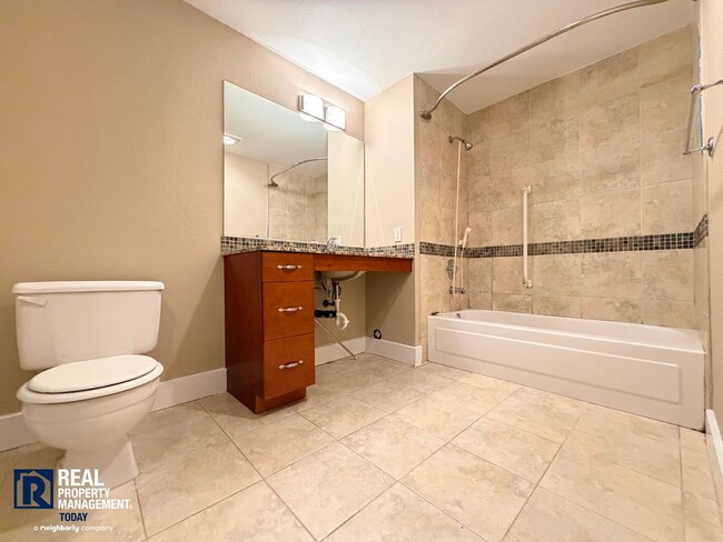 Building Photo - Updated 2 Bed Condo Near the Narrows – Water Views, Covered Parking & Prime Tacoma Location!