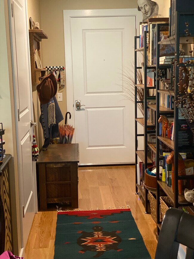 Entry with coat rack and storage bench - 69 Etna Rd