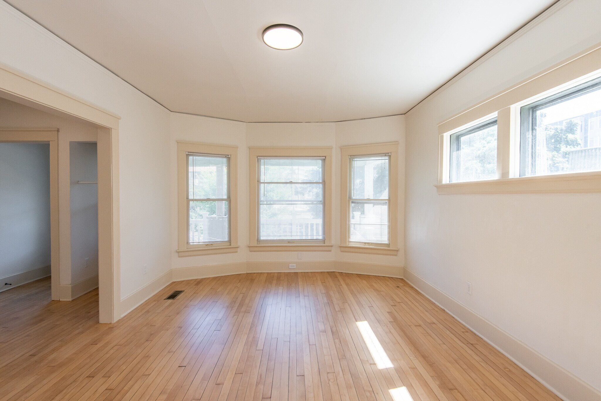 Living Room with Bay Windows - 2415 N Murray Ave