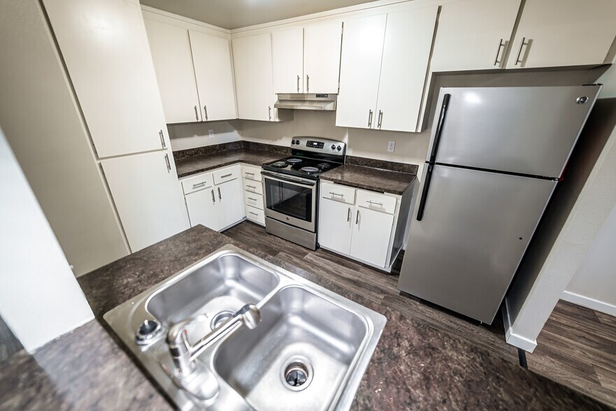 Updated kitchen with lots of cabinets - 12817 4th Dr SE