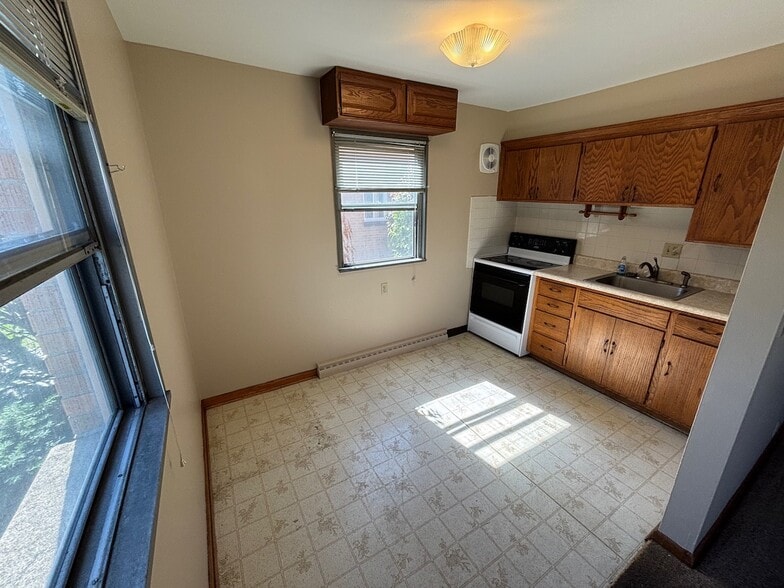 Kitchen - new vinyl floors going in - 3957 N 92nd St
