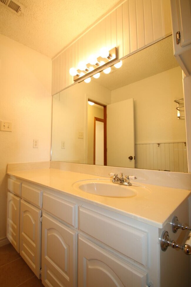 Building Photo - Corner Lot Charmer Off Chapel Creek | 4BR/2BA with Fireplace, Garden Tub & Fenced Backyard