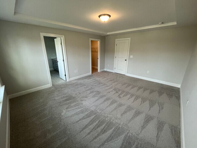Building Photo - Newly Built 4BD, 3BA Cary Townhome with Modern Amenities and Screened-In Patio