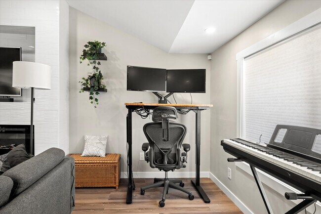 A productivity paradise with standing desk, dual monitors, and Roland FP-10 Piano - 4206 N Winnifred St