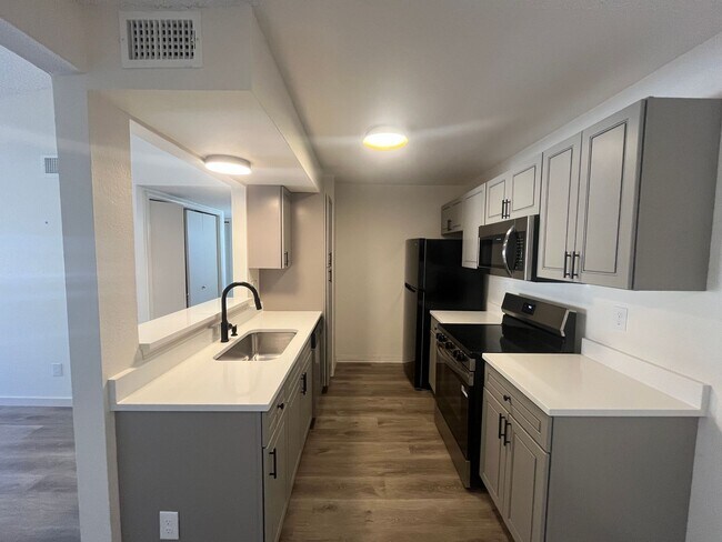 Building Photo - GORGEOUSLY REMODELED 2 bed 2 bath on 3rd floor with vaulted ceiling and skylight!