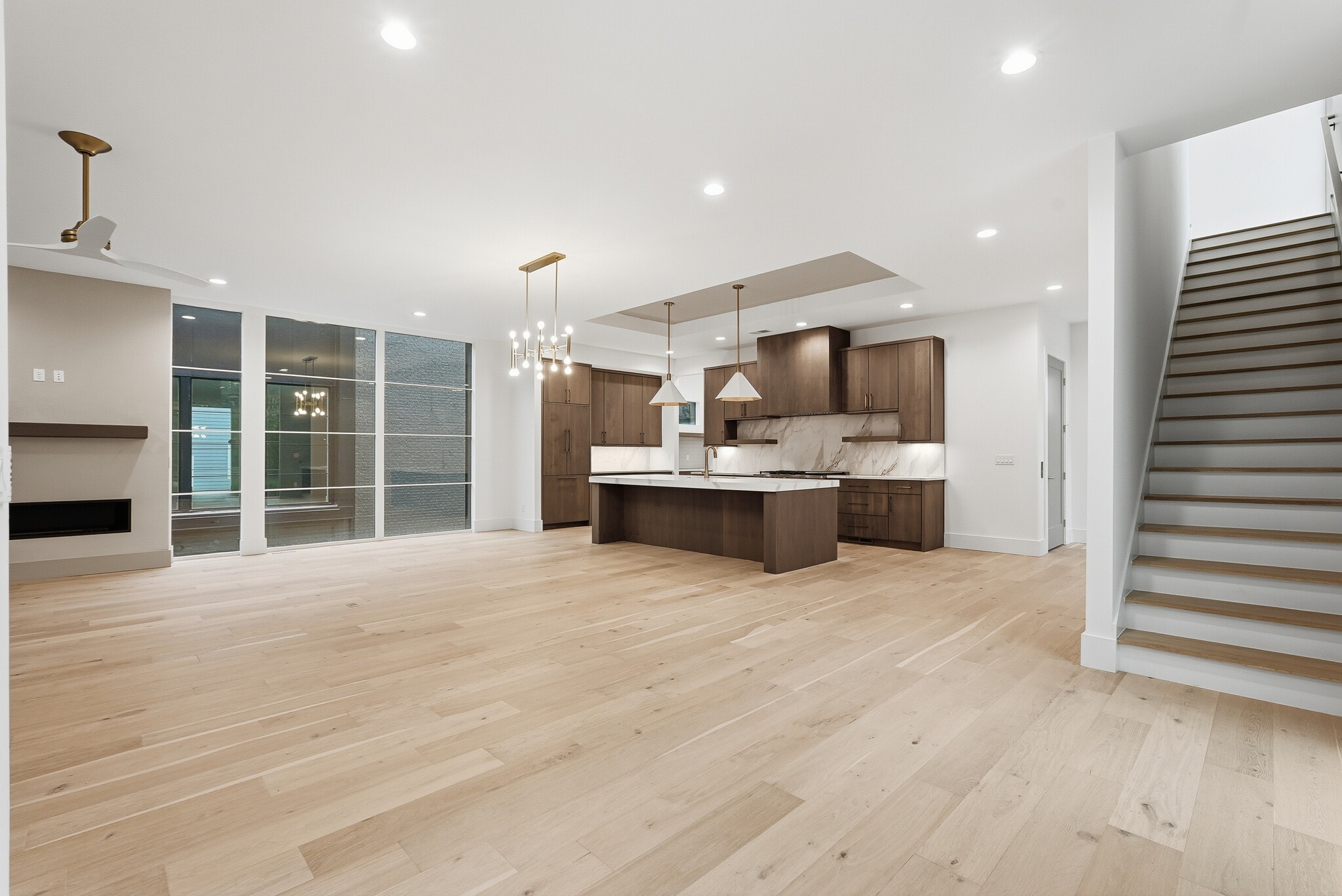 Expansive open concept living space with floor to ceiling windows and seamless flow into the kitchen - 3718 West End Ave