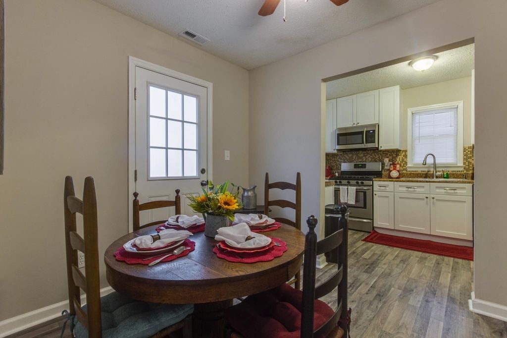 Dining Area to back doorStaged for Marketing only - 221 Fishburne St