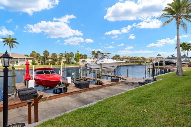 Building Photo - Furnished Gulf Access Canal View Boat Lift...