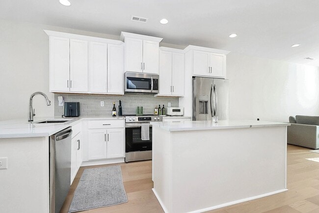 Building Photo - LoSo Terrace like new townhome available f...