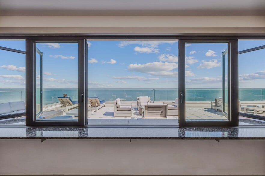 Oceanside outdoor patio at The Alexa Luxury Apartments in Corpus Christi, TX. - The Alexa Luxury Apartments I & II