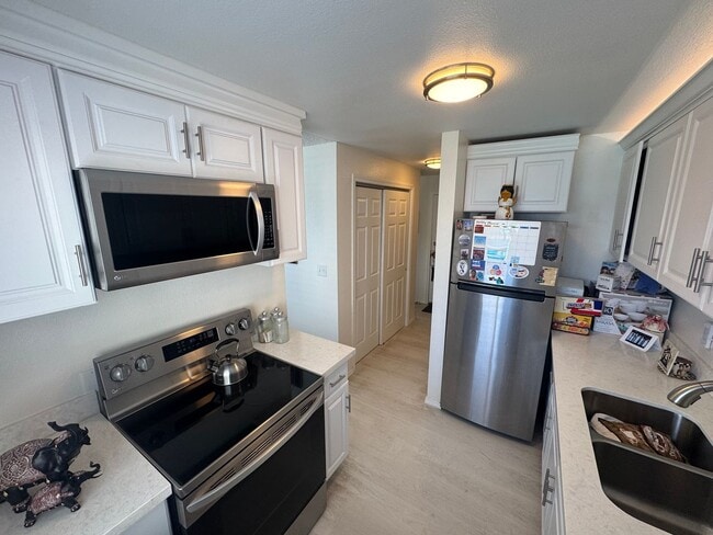 Building Photo - Gorgeous Condo in Seward Park with 2 Parking Spaces, Steps Away from Pool with Water View!