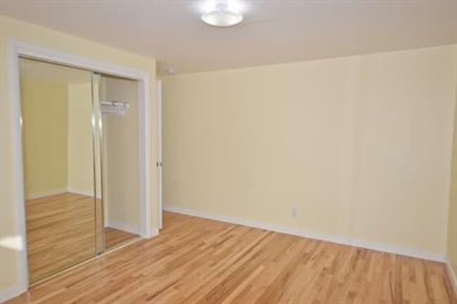 Building Photo - Updated house with original hardwoods and 2-car garage!