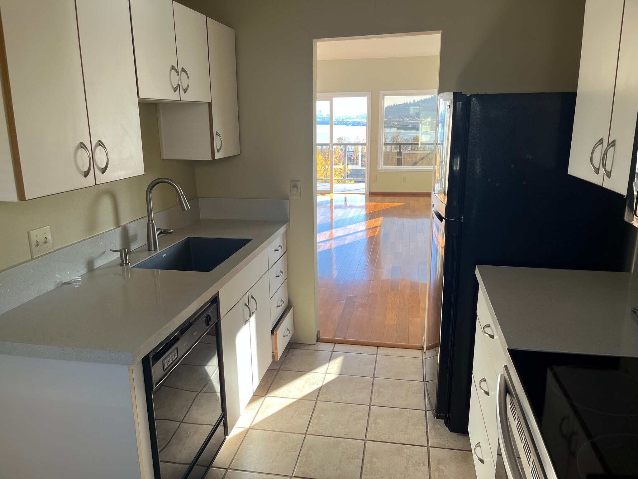Kitchen with view across dining area into living room - 7511 N Edgewater Ave