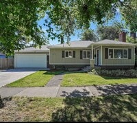 Building Photo - Available Now! 5 bedroom house with large yard and RV parking!