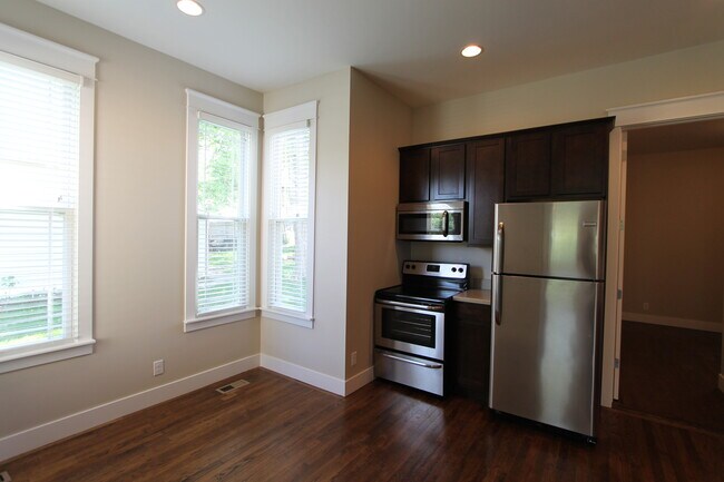 Building Photo - Midtown Renovated Duplex - Hardwood Floors, Exposed Brick