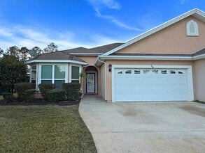 Building Photo - 3/2 with grass cutting included & access to community amenities.