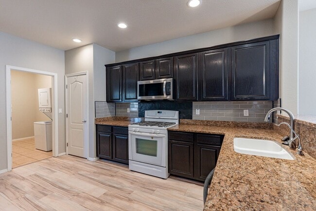 Building Photo - Four Bedrooms, 3 Car Garage - New flooring!