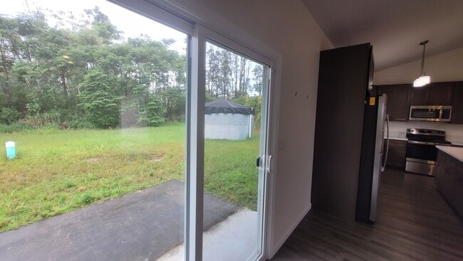 Building Photo - This 3-bedroom, 2-bath home in Orchidland Subdivision