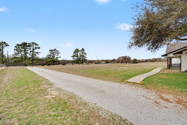 Building Photo - “4-Bedroom, 3-Bath Farmhouse Charm Meets Modern Luxury on a Serene 5-Acre Lot!”