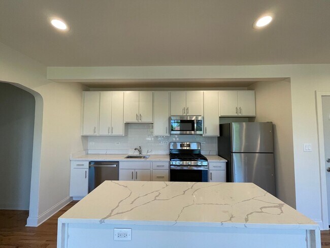 Building Photo - Brand New Renovation! 3 BR/ 2 BA On Quiet ...