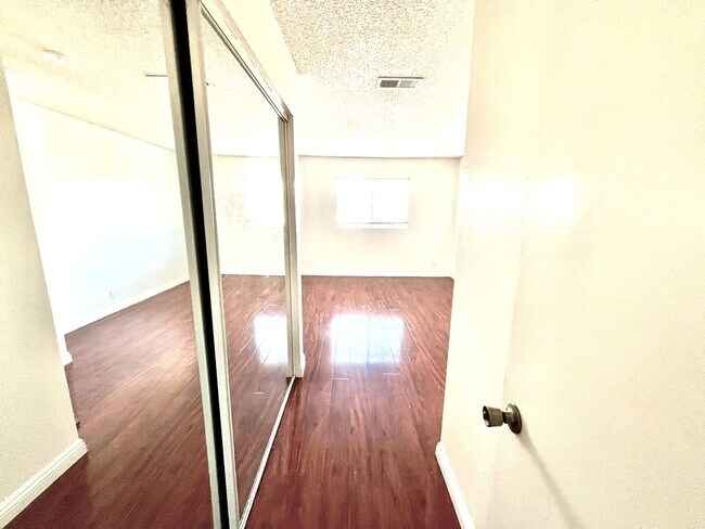 Building Photo - 2 Bedroom, 2 Bath Upstairs Condo with Private Balcony & 2-Car Garage, Gated Community, Water/Tras...