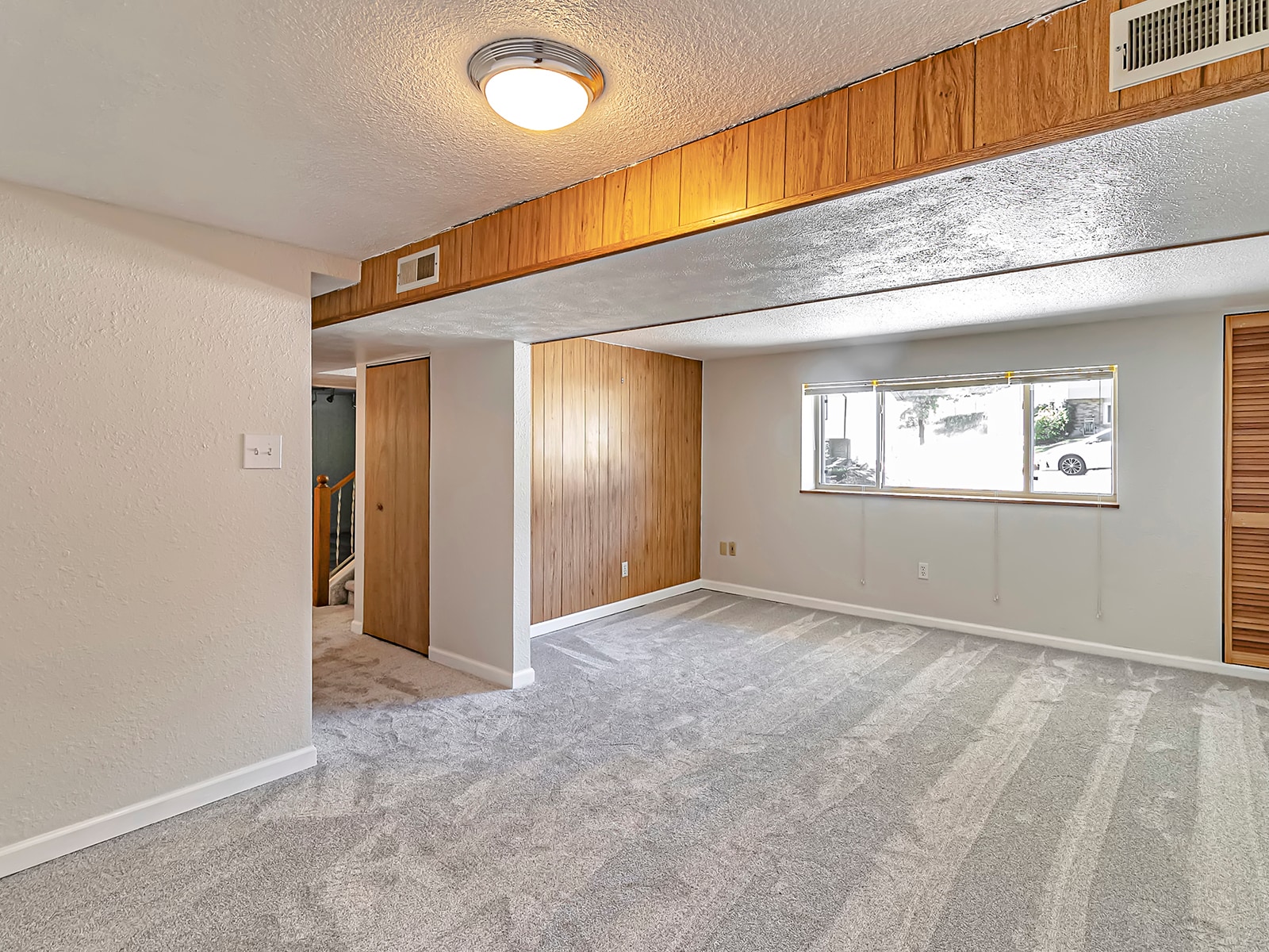 Lower Level Living Room or 5th Bedroom - 123 Orion St
