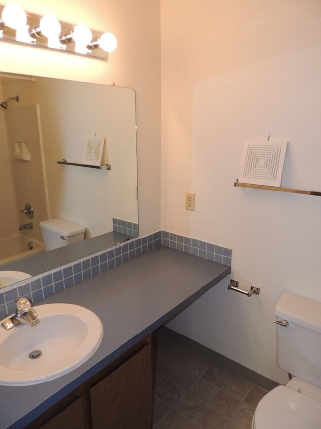 Building Photo - Wood Village End Unit Condo * Covered Park...