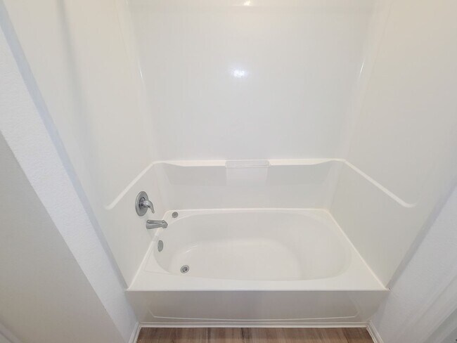 Building Photo - This single-story home has a comfortable layout with three bedrooms and a living area all on one ...