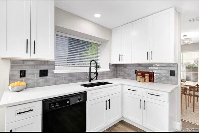 Building Photo - "Charming 4-Bedroom Home with Elegant Gran...
