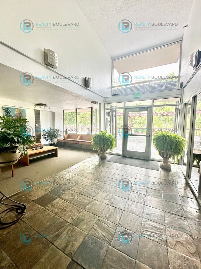Building Photo - Exquisite 1-bedroom, 2-bathroom condo Overlooking the beautiful Truckee River with covered parking!