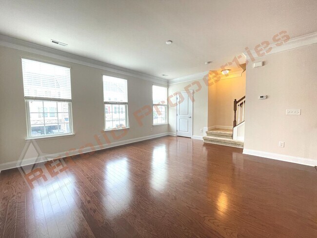 Building Photo - Beautiful 3 Story 3 Bedroom Townhouse with Huge 1st Floor Flex Space with Access to Patio + 2 Car...